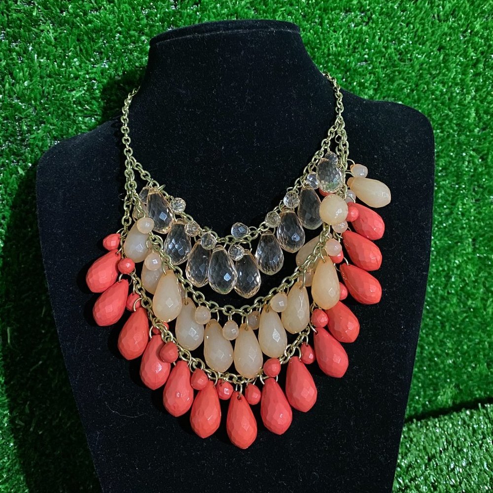 Necklace, three rows of what looks kind of like teardrops